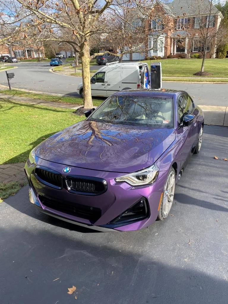 Thundernight Metallic BMW 2 Series with high-gloss ceramic coating on a Northern Virginia driveway