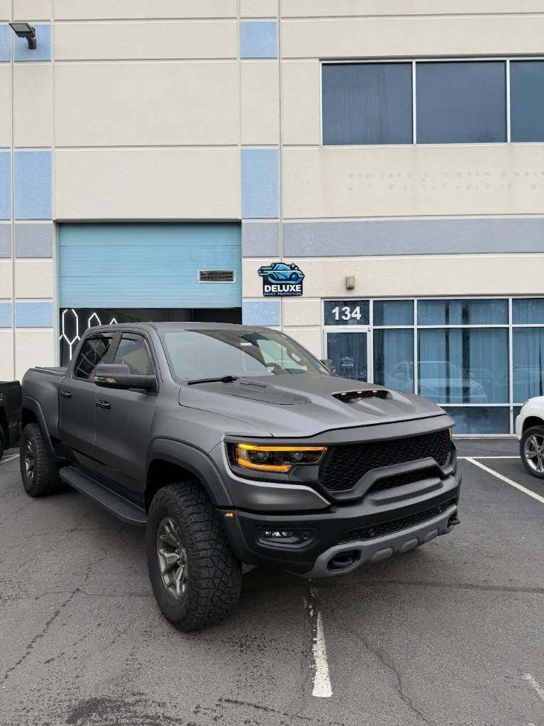 Matte charcoal RAM 1500 TRX with stealth PPF at Deluxe Paint Protection Unit 134 in Chantilly