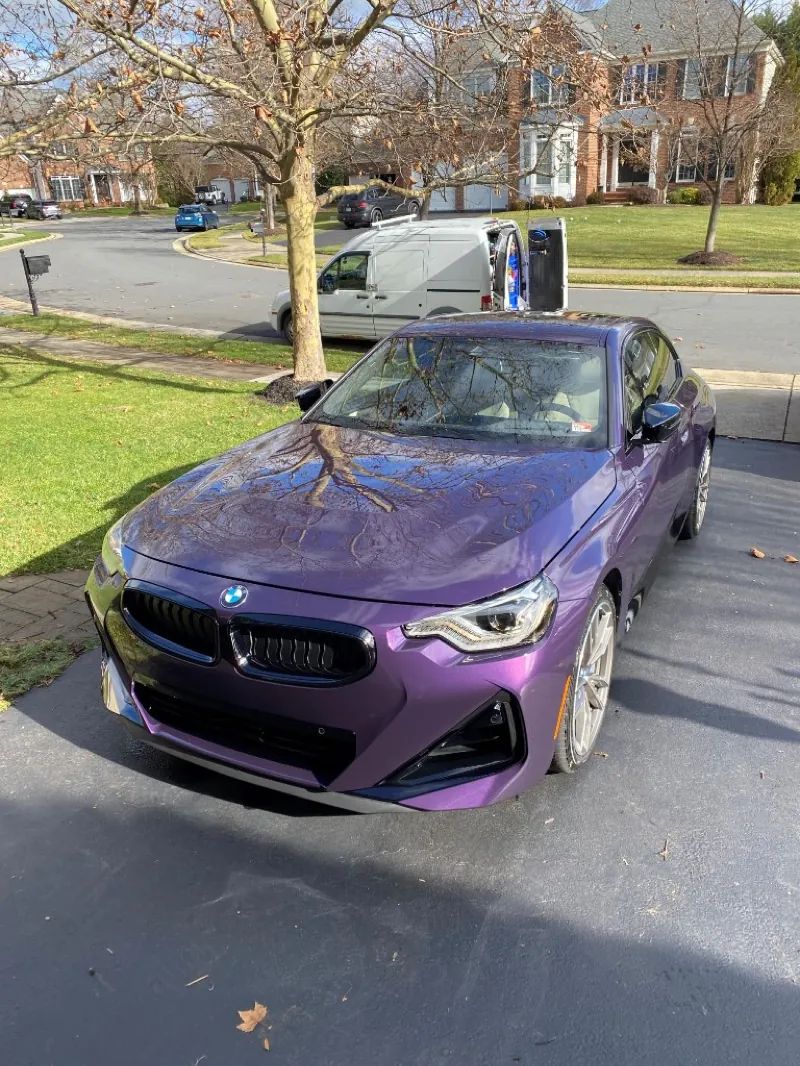 Thundernight Metallic BMW 2 Series with high-gloss ceramic coating on a Northern Virginia driveway
