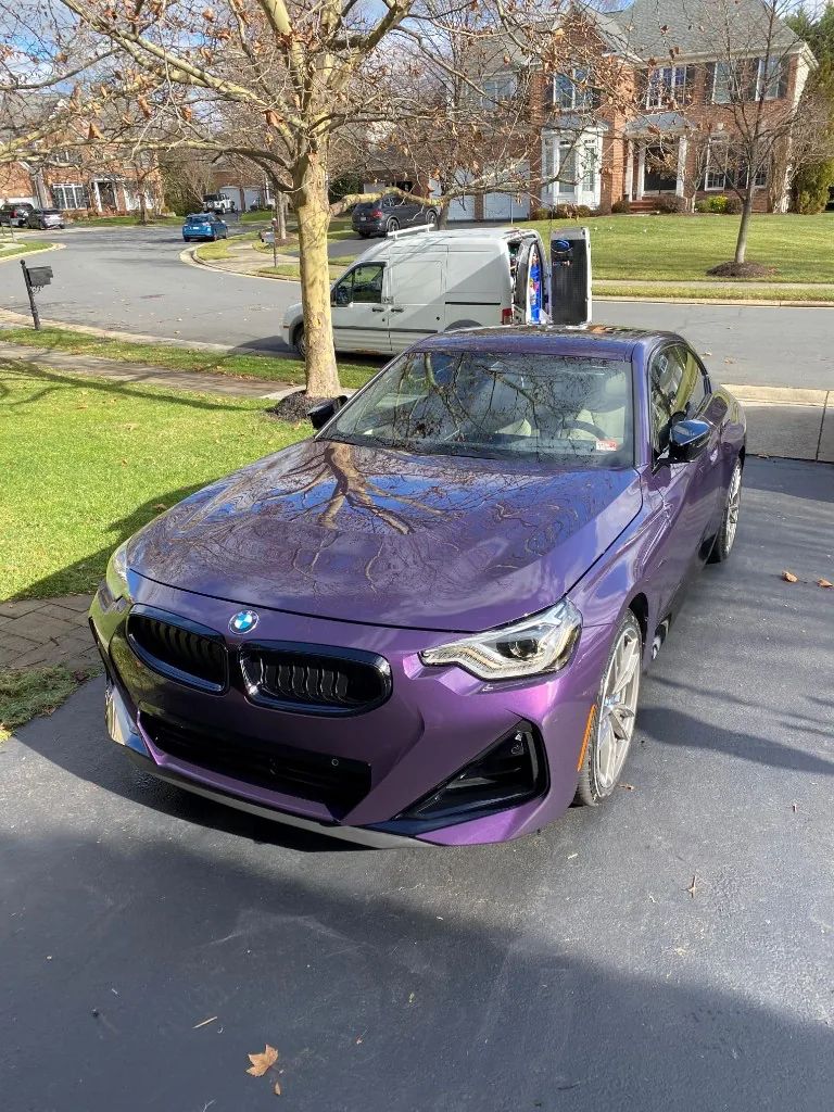 Thundernight Metallic BMW 2 Series with high-gloss ceramic coating on a Northern Virginia driveway